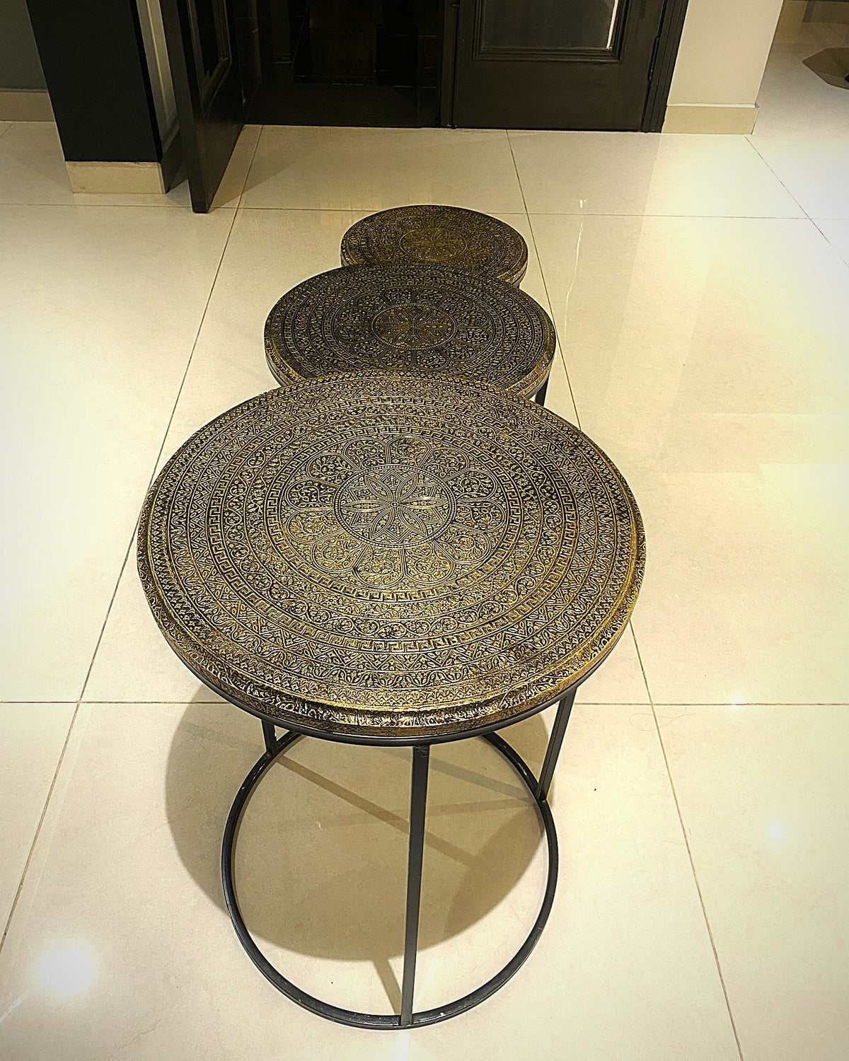 Mandala nesting tables lined up in a hallway