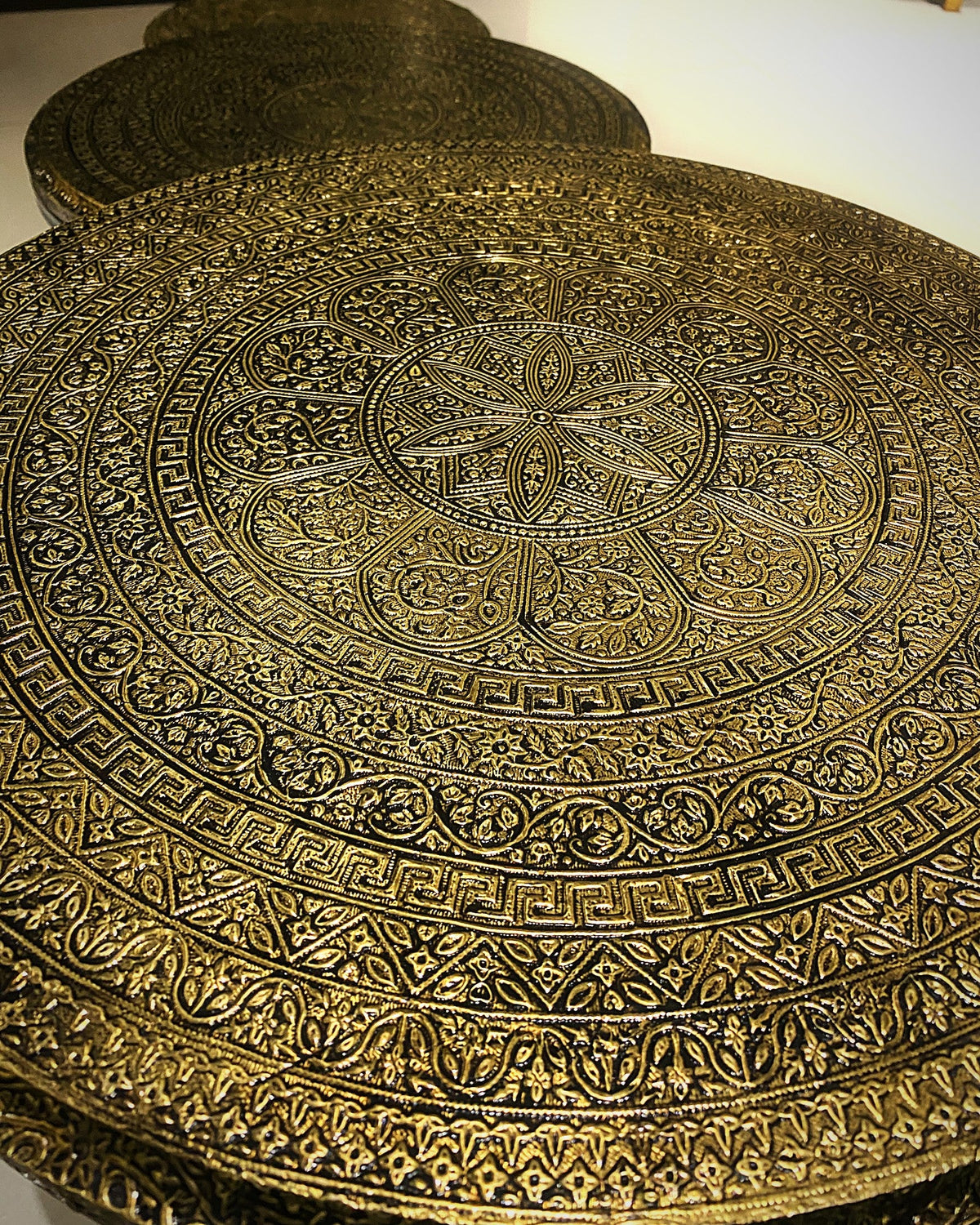 Embossed gold mandala pattern up close
