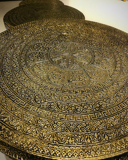 Embossed gold mandala pattern up close