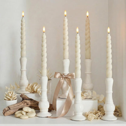 Spiral LED candles styled on a white table