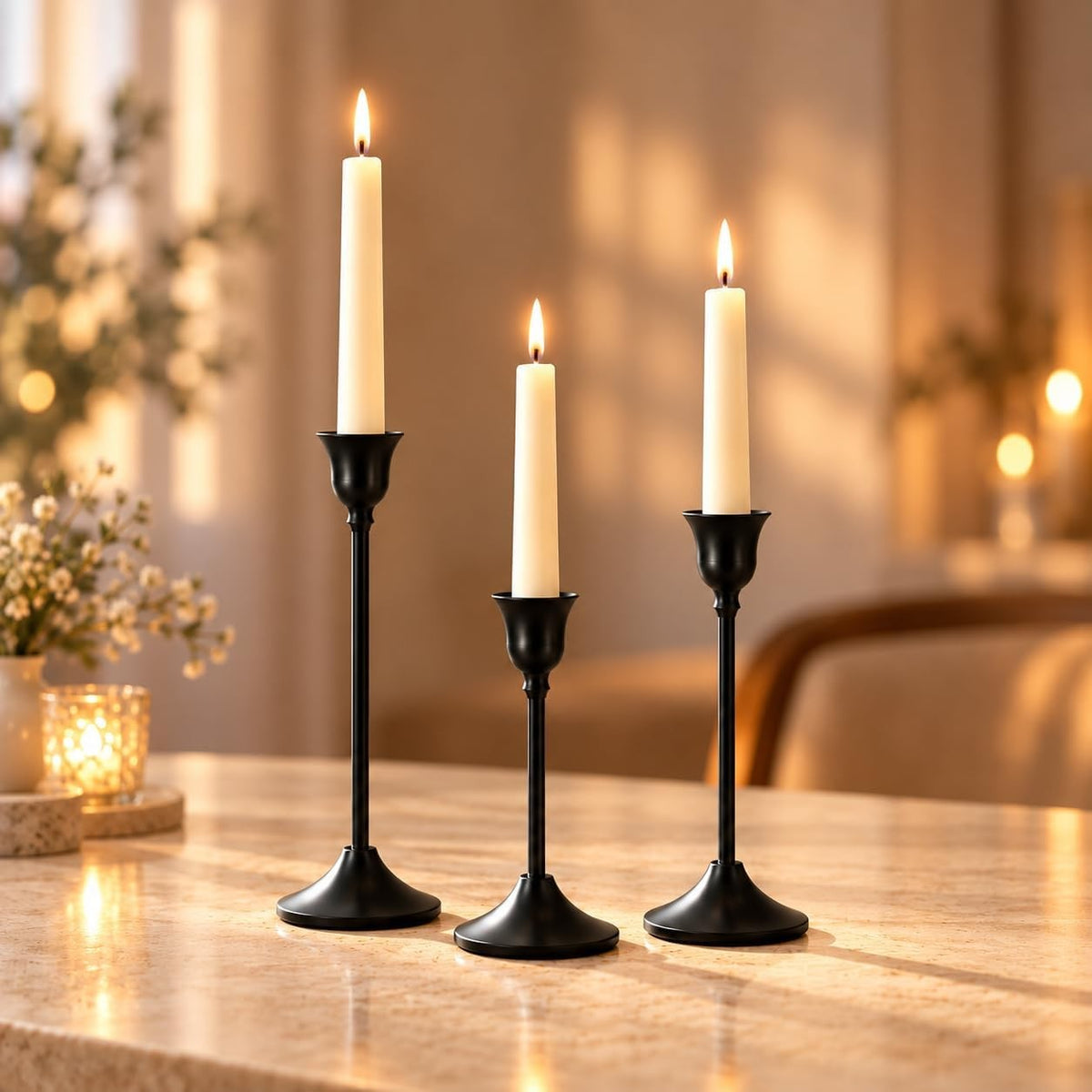 Black taper holders glowing with white candles