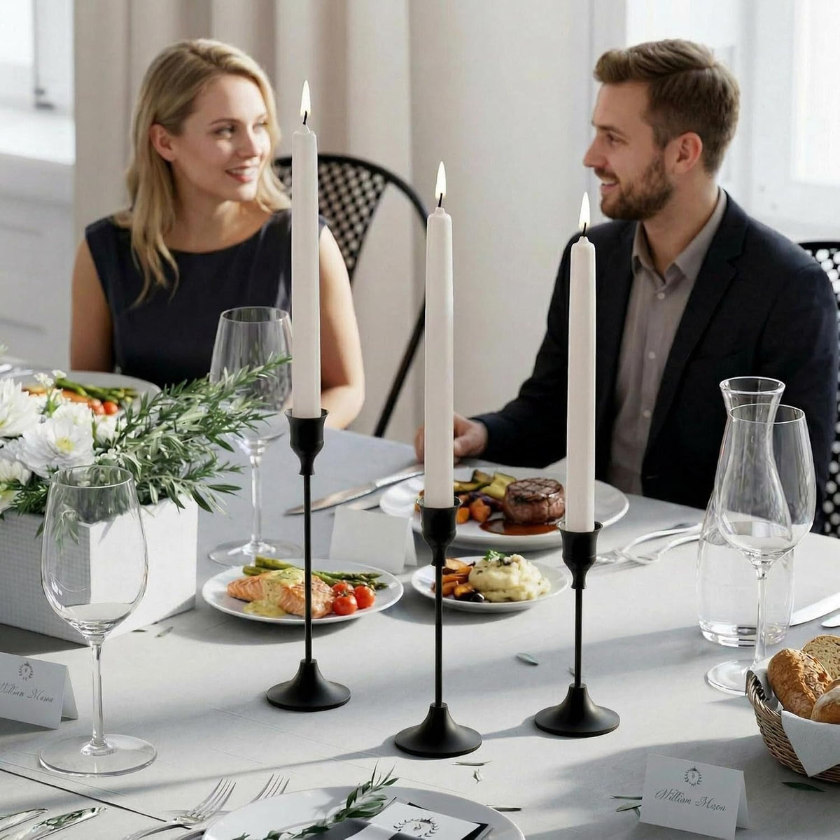 Black candle holders on a candlelit dinner for two