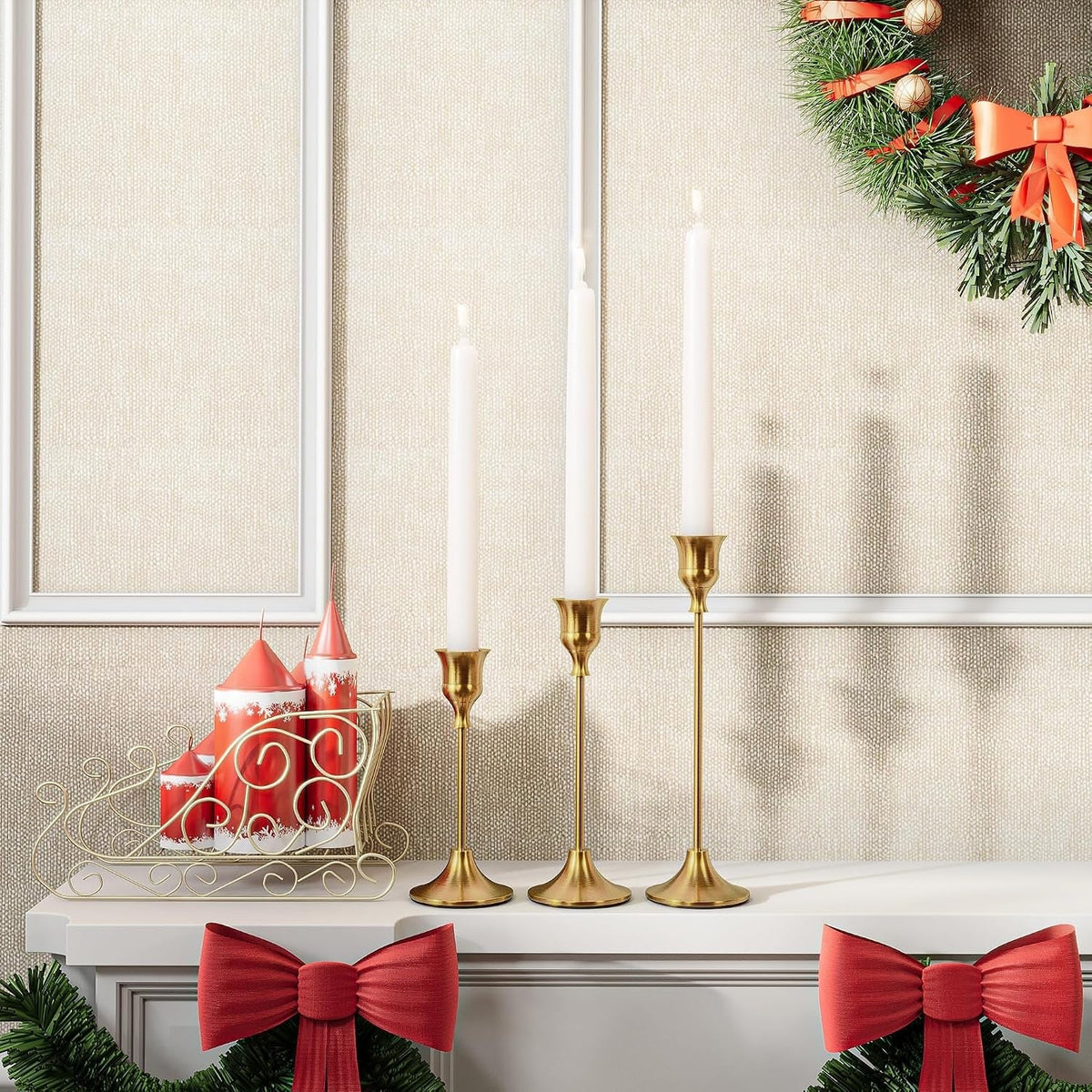 Gold bell candle holders styled on a festive mantel